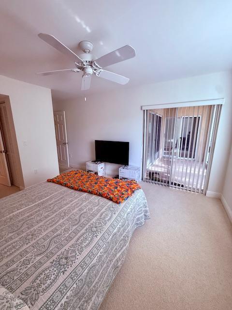 242 Village Blvd Unit 2203, Tequesta, FL 33469 - carpeted bedroom featuring ceiling fan and baseboards