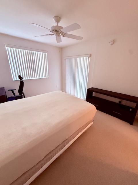 bedroom with carpet flooring and ceiling fan