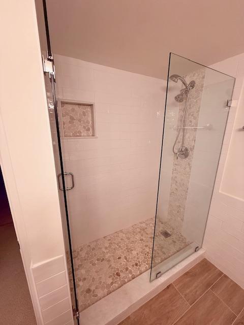 full bathroom featuring a shower stall