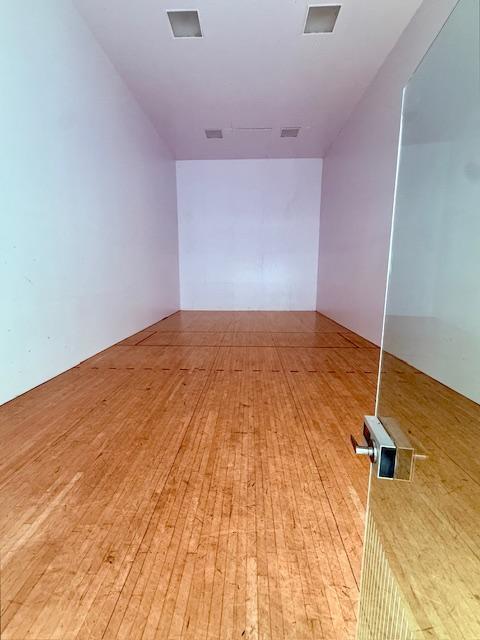 unfurnished room with light wood-type flooring