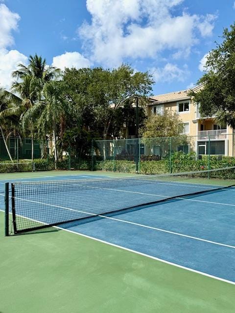 view of sport court with fence