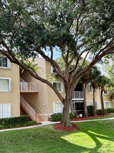 242 Village Blvd Unit 2203, Tequesta, FL 33469 - view of building exterior with stairway