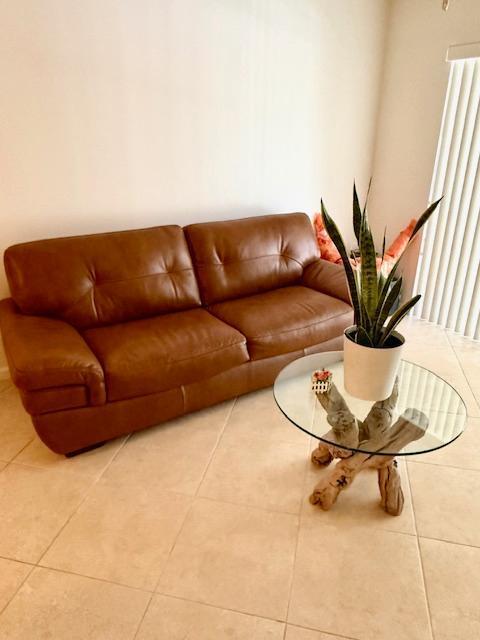 living room with light tile patterned floors