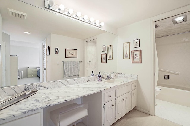 bathroom featuring toilet, visible vents, shower / tub combination, and vanity