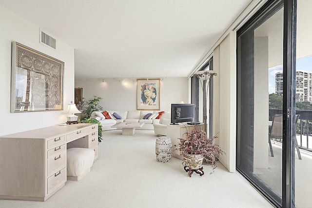 living room featuring light colored carpet and visible vents