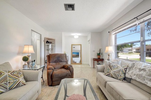 245 Bilbao St, Royal Palm Beach, FL 33411 - living room featuring a textured ceiling