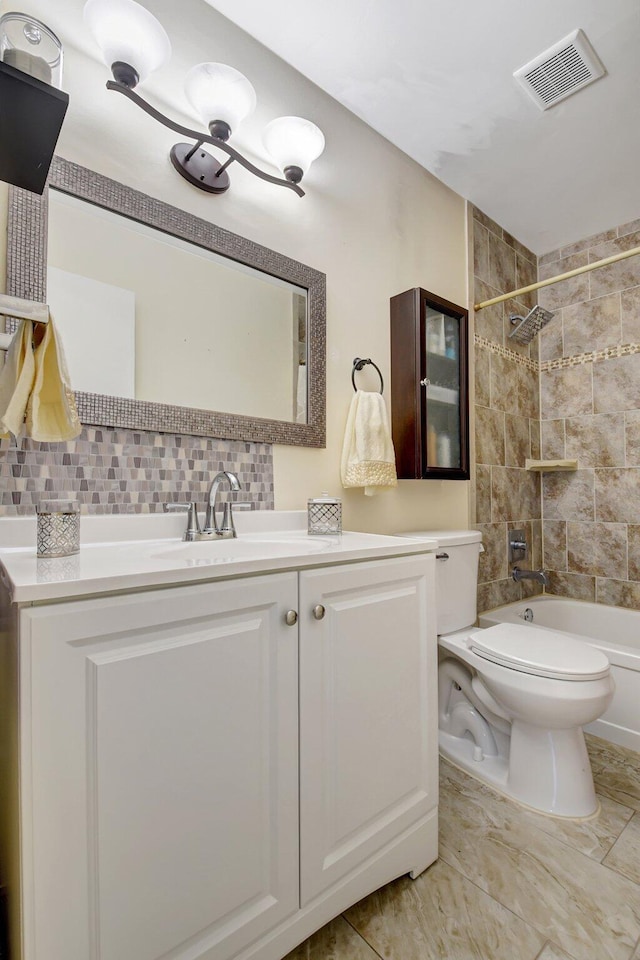 245 Bilbao St, Royal Palm Beach, FL 33411 - bathroom featuring toilet, vanity, tasteful backsplash, and shower / bath combination