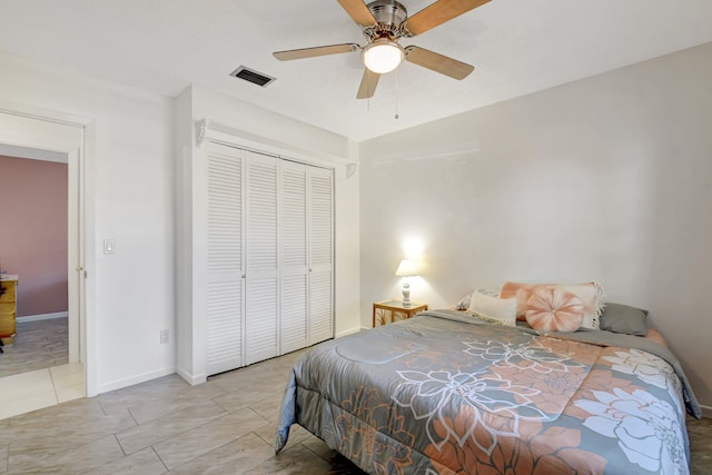 245 Bilbao St, Royal Palm Beach, FL 33411 - bedroom with a closet, a ceiling fan, tile patterned floors, and baseboards