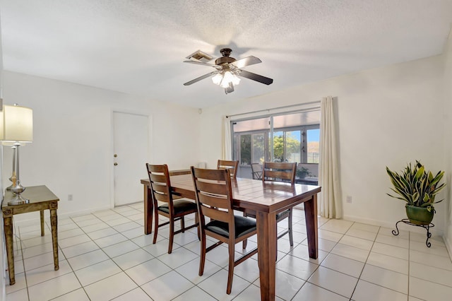 245 Bilbao St, Royal Palm Beach, FL 33411 - dining room with ceiling fan, light tile patterned floors, a textured ceiling, and baseboards