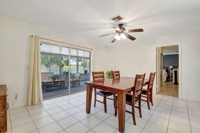 245 Bilbao St, Royal Palm Beach, FL 33411 - dining area with ceiling fan, light tile patterned flooring, and baseboards