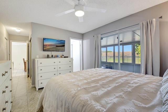 245 Bilbao St, Royal Palm Beach, FL 33411 - bedroom with a textured ceiling, light tile patterned floors, ceiling fan, and access to exterior