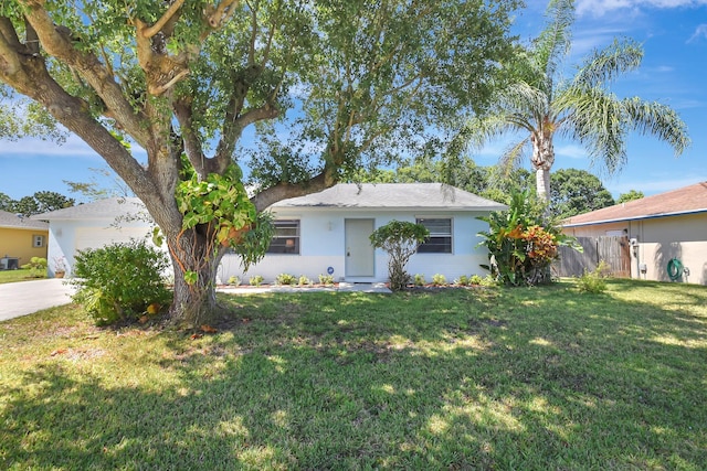 245 Bilbao St, Royal Palm Beach, FL 33411 - single story home featuring driveway, an attached garage, and stucco siding