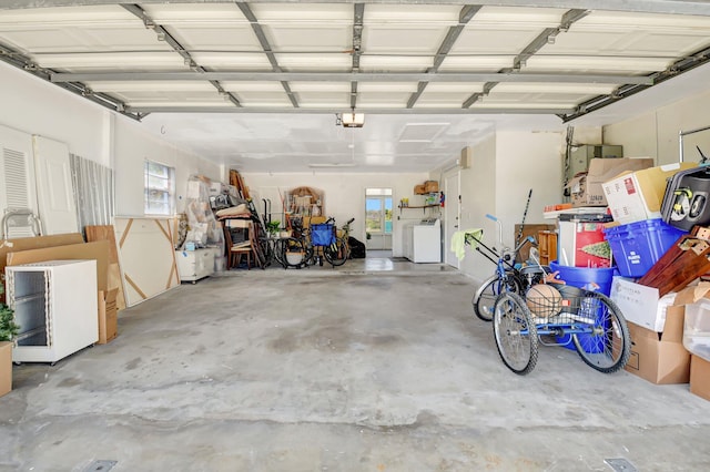 245 Bilbao St, Royal Palm Beach, FL 33411 - garage with a garage door opener and independent washer and dryer