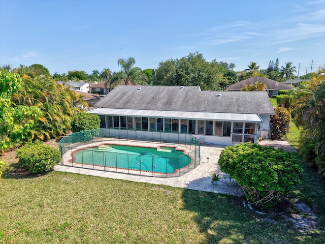 245 Bilbao St, Royal Palm Beach, FL 33411 - swimming pool with a sunroom and a patio