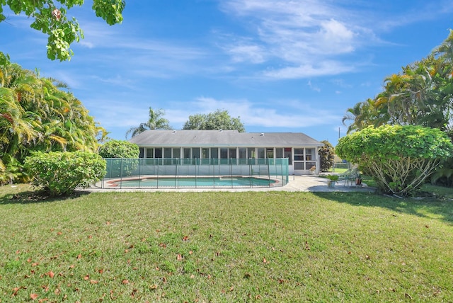 245 Bilbao St, Royal Palm Beach, FL 33411 - rear view of property with a sunroom and a patio area