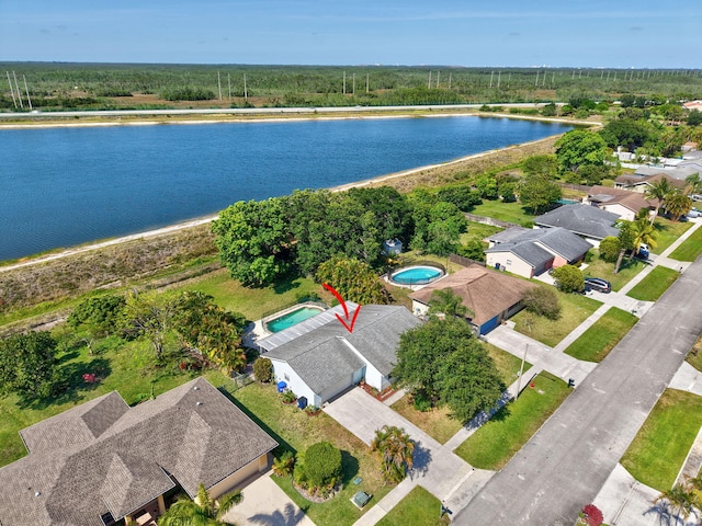 245 Bilbao St, Royal Palm Beach, FL 33411 - drone / aerial view of a large body of water and a pool
