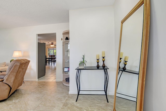 245 Bilbao St, Royal Palm Beach, FL 33411 - foyer featuring baseboards and a textured ceiling