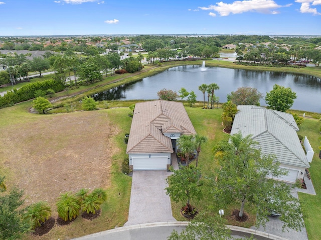 9943 SW Stonegate Dr, Port Saint Lucie, FL 34987 - aerial view of property and surrounding area featuring a large body of water and a tree filled landscape