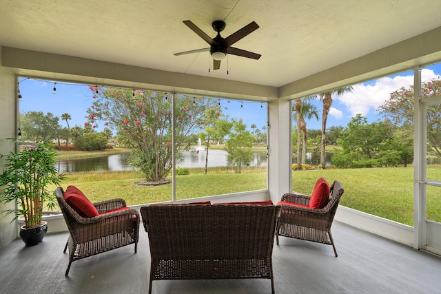 9943 SW Stonegate Dr, Port Saint Lucie, FL 34987 - sunroom featuring a water view, a ceiling fan, and an outdoor hangout area