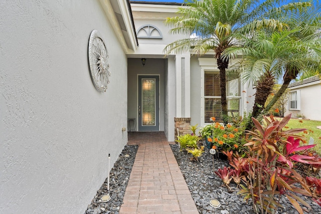 9943 SW Stonegate Dr, Port Saint Lucie, FL 34987 - property entrance with stucco siding