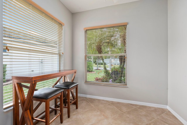 9943 SW Stonegate Dr, Port Saint Lucie, FL 34987 - dining area featuring baseboards and light tile patterned floors