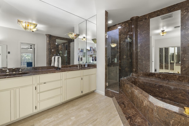 bathroom featuring a stall shower, a bath, a ceiling fan, and a sink