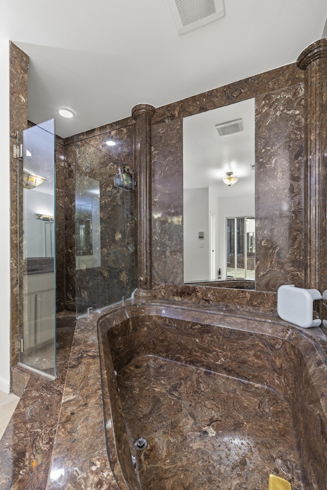 bathroom featuring visible vents and marble finish floor