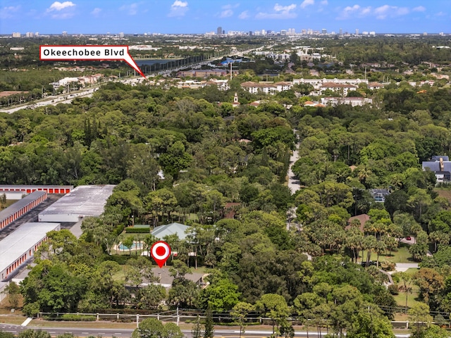 8785 Thousand Pines Cir, West Palm Beach, FL 33411 - view of property location with a large body of water and a heavily wooded area