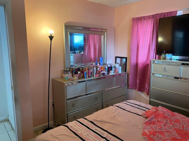 bedroom featuring tile patterned floors