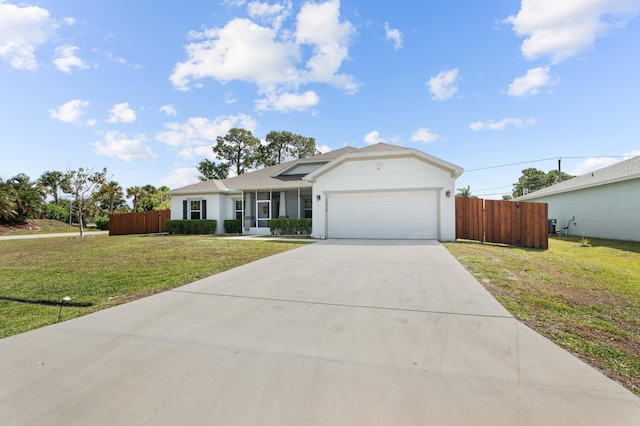 single story home with fence, an attached garage, a front lawn, and driveway