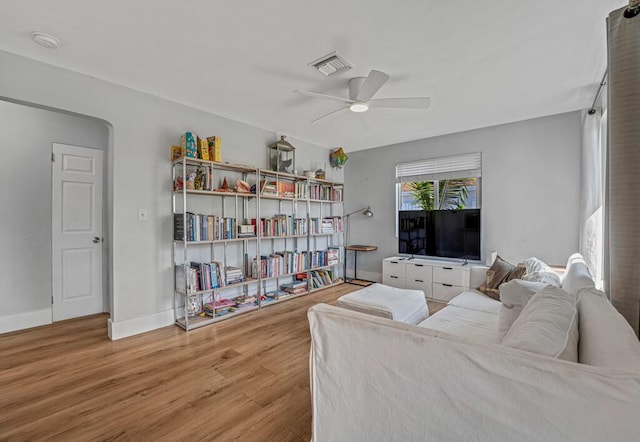923 N H St, Lake Worth Beach, FL 33460 - living area featuring baseboards, a ceiling fan, wood finished floors, and visible vents