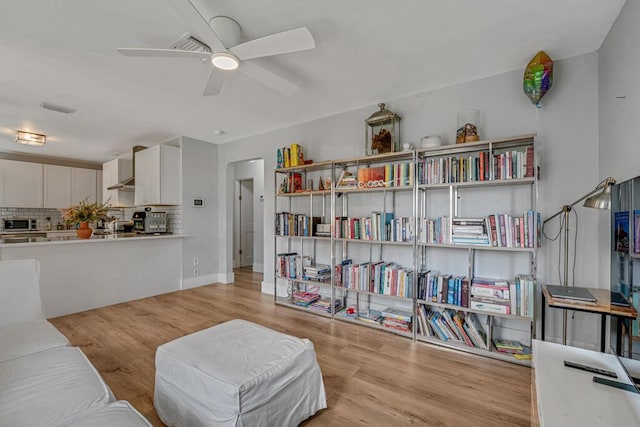 923 N H St, Lake Worth Beach, FL 33460 - living area featuring visible vents, light wood-style floors, and ceiling fan