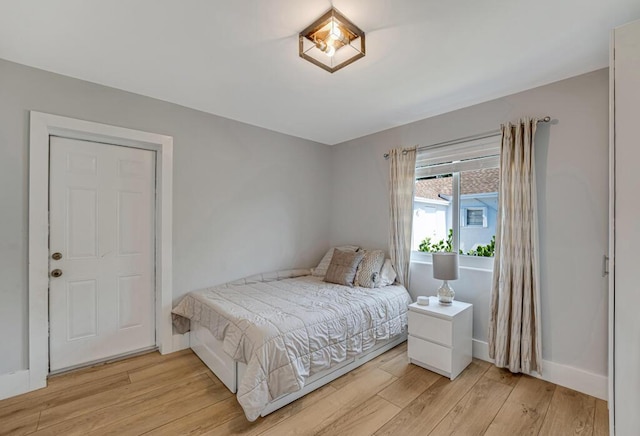 923 N H St, Lake Worth Beach, FL 33460 - bedroom featuring baseboards and light wood finished floors