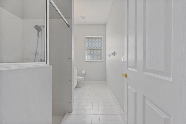1317 Beacon Cir, Wellington, FL 33414 - full bath with a tile shower, toilet, tile patterned flooring, and baseboards