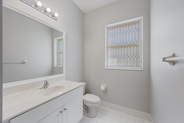 1317 Beacon Cir, Wellington, FL 33414 - bathroom featuring toilet, vanity, baseboards, and tile patterned floors