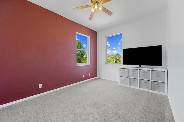 1317 Beacon Cir, Wellington, FL 33414 - unfurnished living room featuring carpet, ceiling fan, and baseboards