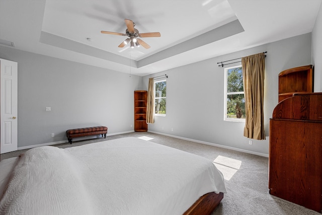 1317 Beacon Cir, Wellington, FL 33414 - bedroom with a tray ceiling, carpet floors, baseboards, and a ceiling fan