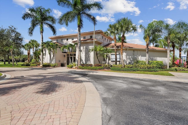 1317 Beacon Cir, Wellington, FL 33414 - mediterranean / spanish house with stucco siding and a tiled roof