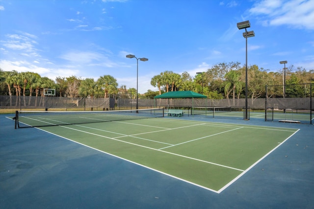 1317 Beacon Cir, Wellington, FL 33414 - view of tennis court with fence and community basketball court