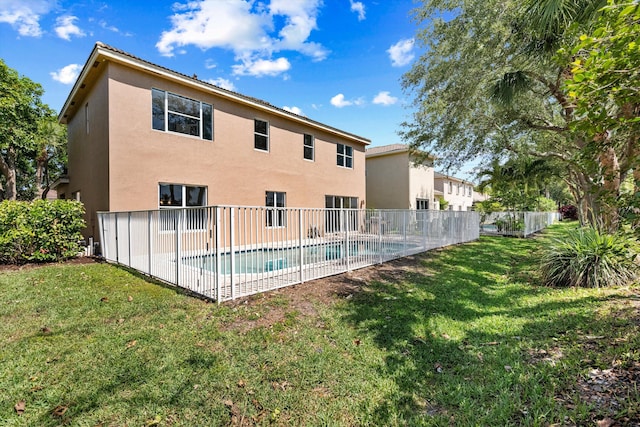 1317 Beacon Cir, Wellington, FL 33414 - rear view of house featuring stucco siding and a patio area