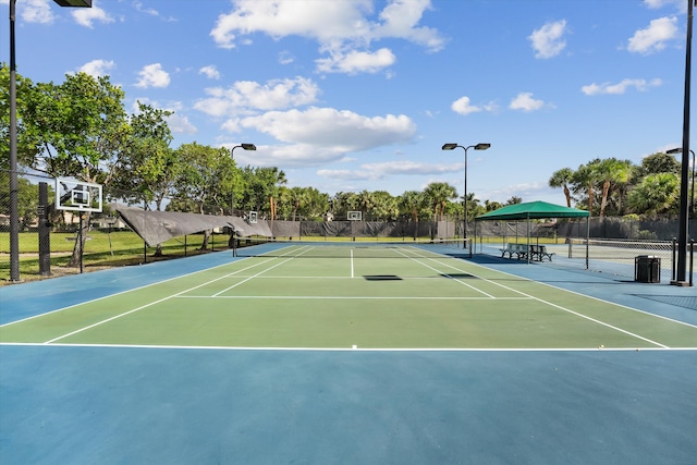 1317 Beacon Cir, Wellington, FL 33414 - view of tennis court with community basketball court and fence