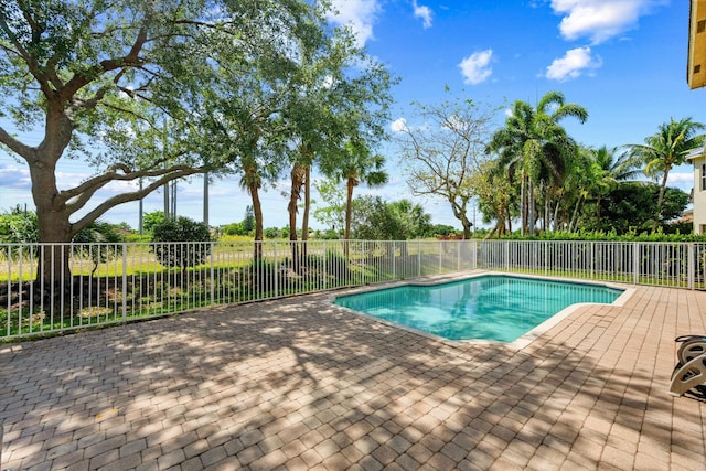 1317 Beacon Cir, Wellington, FL 33414 - view of swimming pool featuring a patio area and fence