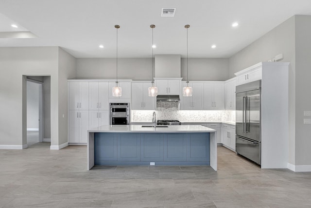 10148 Driftwood Way, Palm Beach Gardens, FL 33412 - kitchen featuring stainless steel appliances, under cabinet range hood, tasteful backsplash, white cabinetry, and light countertops