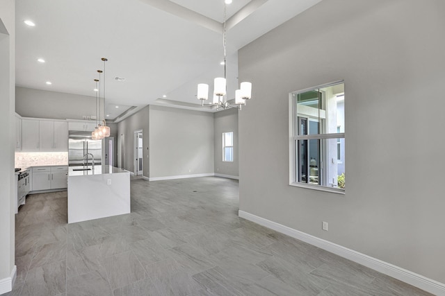 10148 Driftwood Way, Palm Beach Gardens, FL 33412 - kitchen featuring open floor plan, recessed lighting, stainless steel built in refrigerator, a chandelier, and light countertops