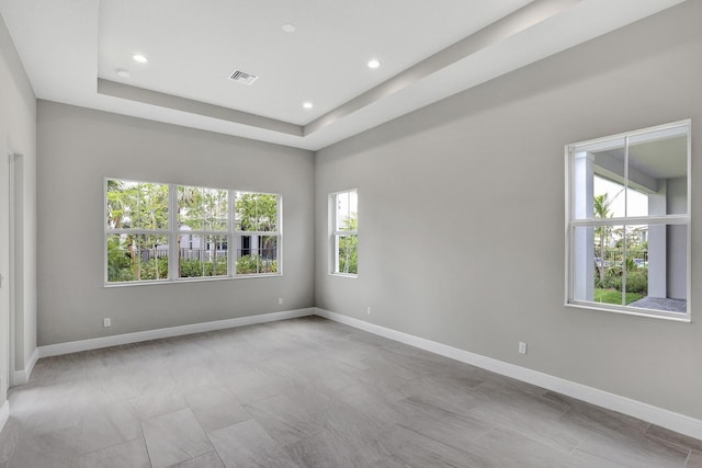10148 Driftwood Way, Palm Beach Gardens, FL 33412 - empty room with baseboards, recessed lighting, and a raised ceiling