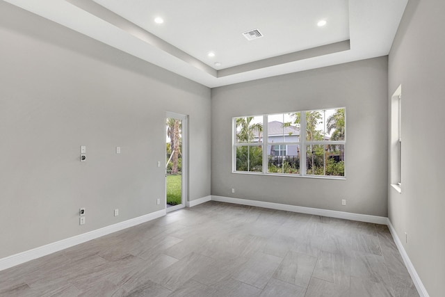 10148 Driftwood Way, Palm Beach Gardens, FL 33412 - unfurnished room with recessed lighting, baseboards, and a tray ceiling