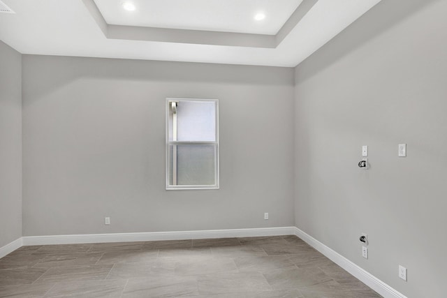 10148 Driftwood Way, Palm Beach Gardens, FL 33412 - spare room featuring baseboards, recessed lighting, and a raised ceiling