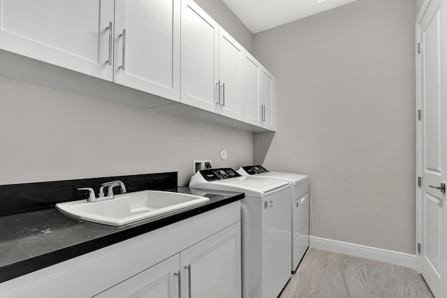10148 Driftwood Way, Palm Beach Gardens, FL 33412 - laundry room with washer and dryer, cabinet space, baseboards, and light marble finish floors
