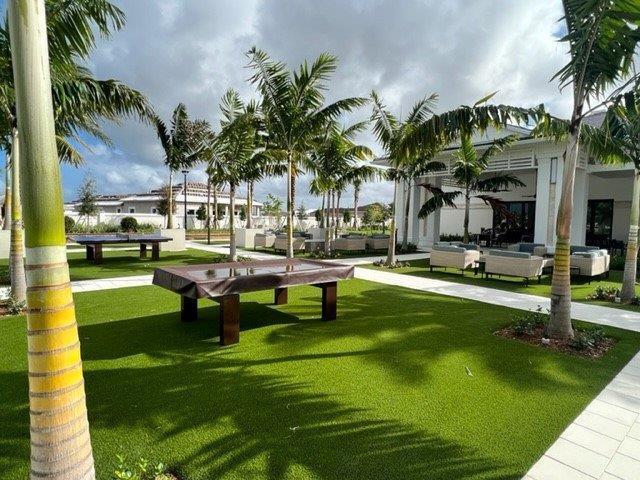 surrounding community with a yard