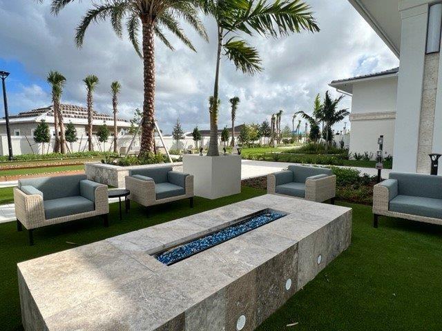view of patio / terrace featuring an outdoor living space with a fire pit